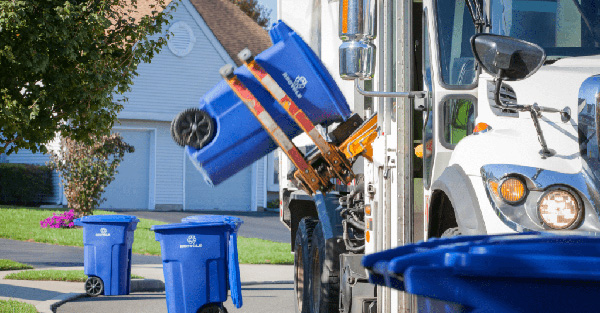 Recycling truck servicing bins